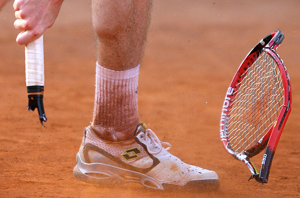 Belgian Kristof Vliegen breaks his racket during a match against Croatian Ivan Ljubicic during the Monte-Carlo ATP Masters Tournament.