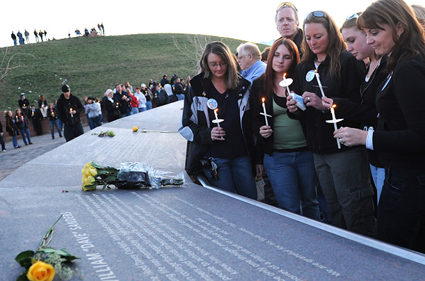 Relatives of a slain teacher mark the tenth anniversary of the Columbine shooting tragedy by standing vigil at the Columbine Memorial near Littleton, Colorado.