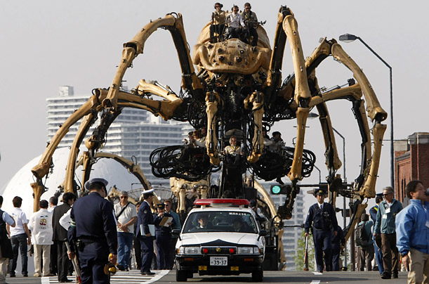 Giant mechanical spiders walk along the waterfront in Yokohama, Japan, as the city celebrates the 150th anniversary of the opening of its port.