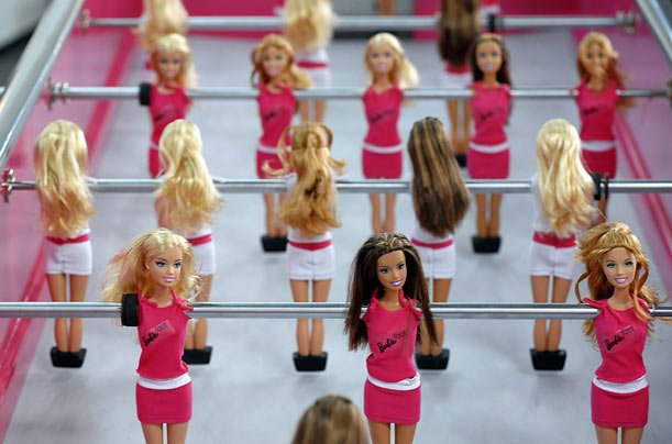 A table football game using Barbie dolls is displayed at the International Design Festival in Berlin.