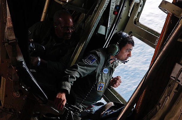 Brazilian Air Force crewmembers look over the Atlantic Ocean in search of wreckage from the missing Air France Rio de Janeiro-Paris flight 447.