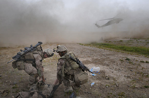 Medics prepare to carry a Marine, who was overcome by heat exhaustion, to a medical evacuation helicopter in the Nawa district of Afghanistan's Helmand province.