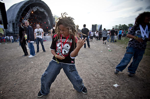 A young spectator enjoys the music of the band Turbo Negro during the Openair Frauenfeld Festival in Switzerland.