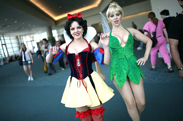 Heather Harris, left, dressed as Snow White and Becky Young, as Tinkerbell, walk the convention floor at Comic Con 2009 in San Diego, California.