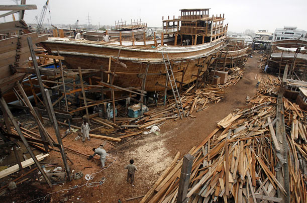 Laborers work in a shipyard in Karachi, Pakistan.