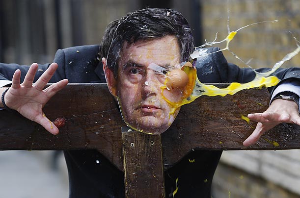 Locals and tourists take part in a little jovial punishment of British Prime Minister Gordon Brown.