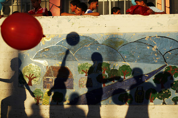 Games
The shadows of Palestinian children playing with balloons appear on a wall in the West Bank city of Ramallah.