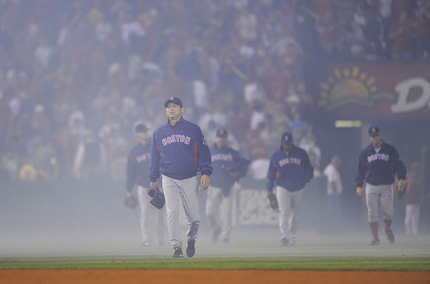 Tough Loss
Boston Red Sox's Hideki Okajima walks through a cloud of smoke back to the after the Red Sox lost 4-1 to the