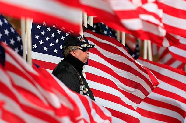 Salute
Walter Matjasich, a veteran and a member of the motorcycle club known as the Patriot Guard, stands watch during the