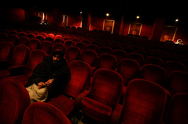 
A man waits to watch Bollywood film ' Hathiyar' or Weapon, at the Ariana Cinema theater, in Kabul, Afghanistan.