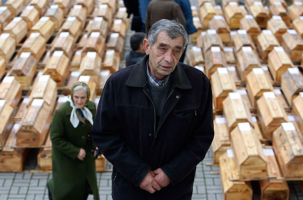 Mourners take part in a reburial ceremony for famine victims in Ukraine's western town of Lviv. D
