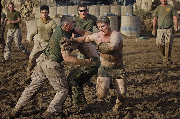 Tough Guys
An American Army soldier runs during a game of mud football at a base in Khan Neshin, Helmand province, Afghanistan.