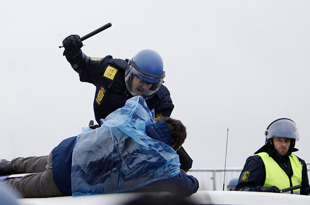 Control
A police officer wields a baton against a protestor near the venue of the United Nations Climate Change Conference 2009 in Copenhagen.