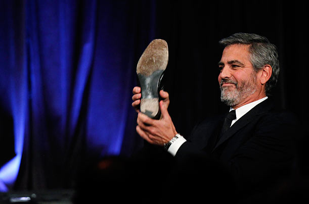 Thank You in Cloonese
George Clooney takes off his shoe as he goes onstage to accept the award for Best Actor for his work in Up In The Air