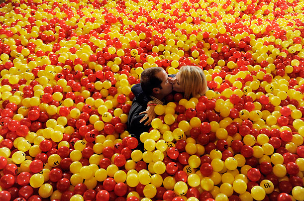 Whoopee!
Carl and Holly Baldwin, who recently won the lottery, kiss in a plastic ball pit during a promotion put on by the Powerball and Mega