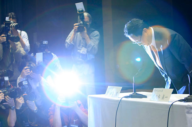 Glare of Scrutiny
Toyota Motor Corp President Akio Toyoda bows at the start of a news conference in Nagoya, Japan. Toyota is recalling some 8 million cars