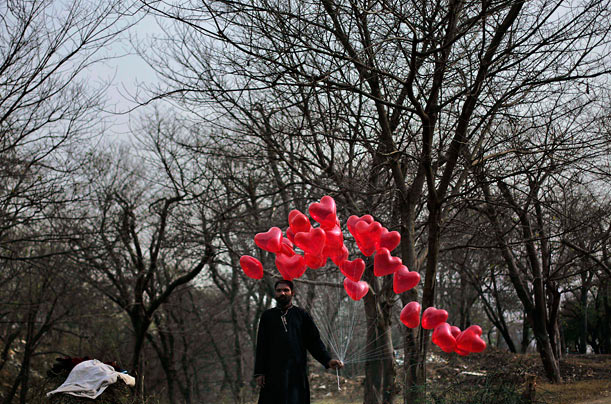 Shine a Light
A Pakistani balloon vendor waits for Valentine's Day customers on a roadside in Islamabad.