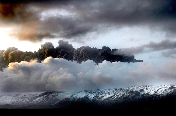 A dark cloud of ash and steam hangs over the Eyjafjallajokull volcano in Iceland after it erupted for the second time in less than one month.
