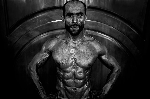 An Afghan bodybuilder competes in a regional bodybuilding competition in Kabul, Afghanistan.