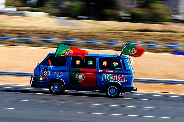 National Pride

A mini-van decorated with Portuguese flags speeds away after the arrival of Portugal's national football team in Johannesburg, South Africa.
