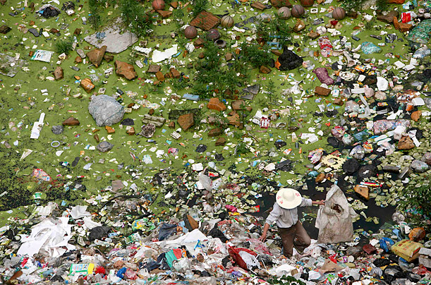 Dirty Job

A man looks for recyclable waste at a garbage dump site on World Environment Day in Baokang, China.