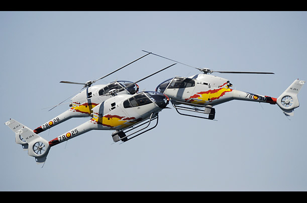 Helicopters of the spanish ASPA Patrol team perform in Vigo, Spain during the International Vigo Airshow.