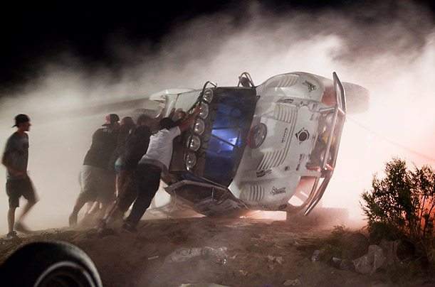 Disaster

Workers push an overturned off-road racing vehicle upright after it ran out of control and into a crowd of spectators during a race in Lucerne Valley, California killing at least eight people.