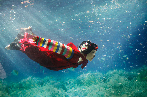 Dive Fashion

A model wearing a traditional Korean hanbok performs in a water tank at the 