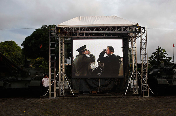 Nicaragua's President Daniel Ortega is seen on a screen, right, with
Army Chief Julio Cesar Aviles in a prerecorded video before a ceremony
commemorating the 31st anniversary of the army in Managua, Nicaragua.