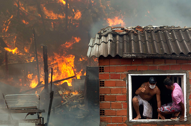 Escape

Residents leave a house through the window during a fire at the Real Parque shantytown in Sao Paulo, Brazil.