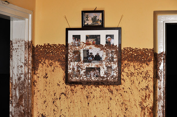 Toxic Memories

Family photos on a wall bear the marks of a flood of toxic mud that flowed through the home in Kolontar, Hungary. The flooding was caused by the rupture of a red sludge reservoir at a metalworks in western Hungary.