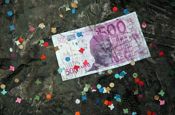 A counterfeit 500 Euro note printed with the effigy of Nicolas Sarkozy lies on the Place de la Nation during a National Union-Led demonstration against retirement reform in