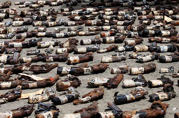 Illegal firearms are displayed before being destroyed in Panama City. The weapons, numbering more than 1,800, were confiscated from criminals and also exchanged by trade for medicine and