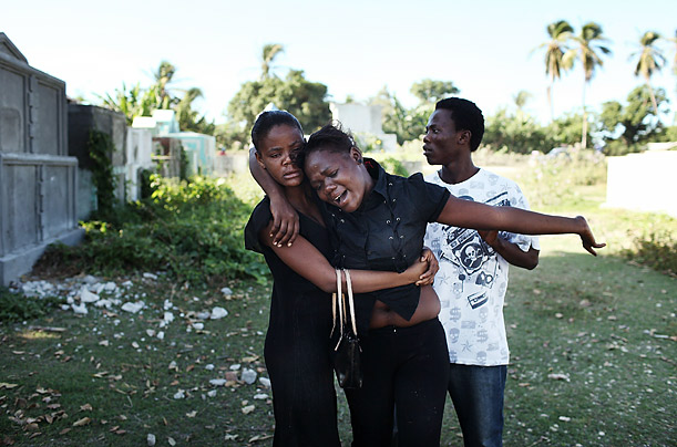 Stricken

Sisters Widlene Pierre, center, and Adonia Bathelemyse, left, grieve in Back D' Aguin, Haiti while burying their mother, Serette Pierre, who recently died of cholera.