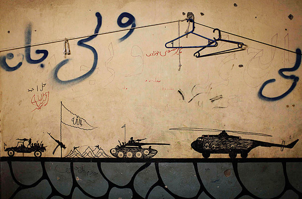Insurgent Art

Graffiti left behind by Taliban fighters remains on the walls of a compound now used as a U.S. Marine Corps command center in Musa Qala, Afghanistan.