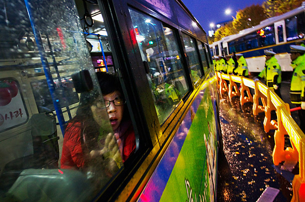 Vivid Blockade

A commuter looks out of a bus window as South Korean police line the street during an anti-G20 protest in Seoul, South Korea.