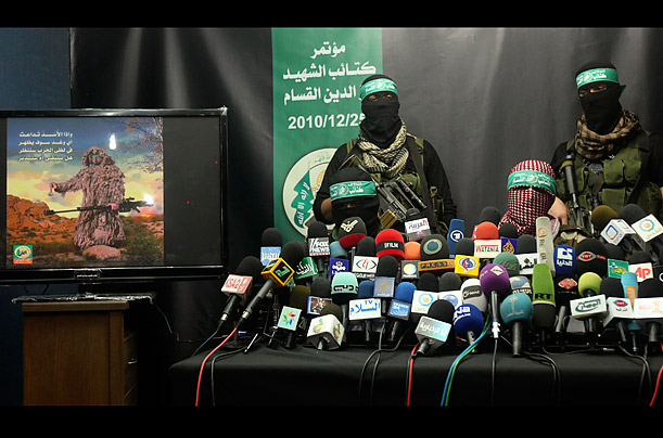 Members of the Al-Qassam brigades, the military wing of Hamas, give
a press conference in Gaza City.
