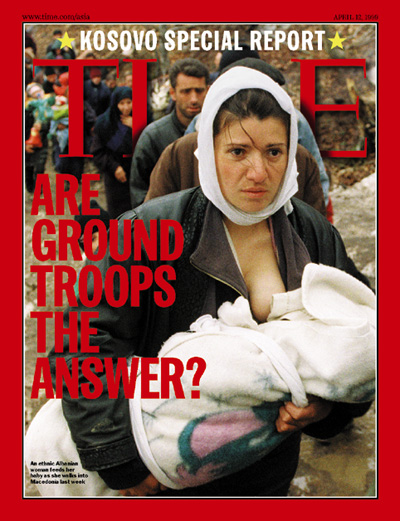 A photo of a woman fleeing war in Kosovo.