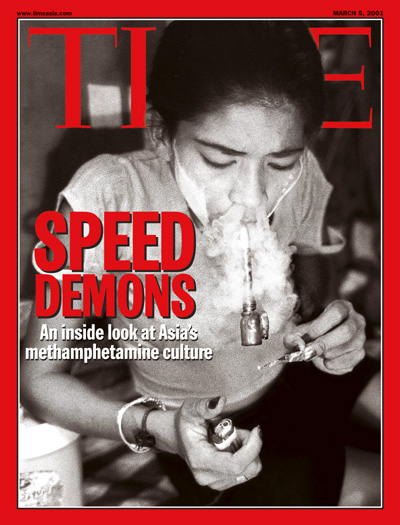 A young Thai smokes methamphetamine