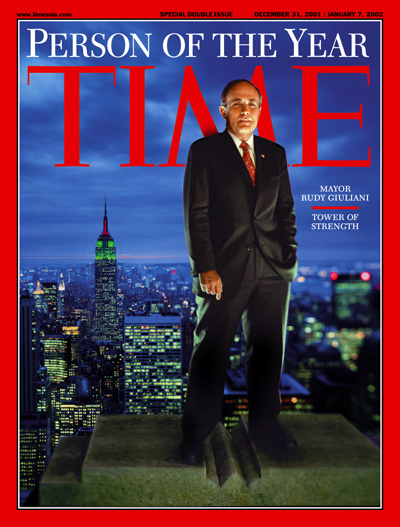 A portrait of Rudy Giuliani on top of a building in New York City.