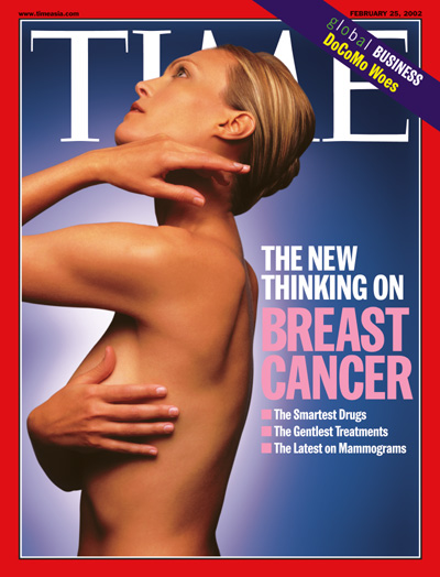 A photo of a woman performing a breast self-exam.