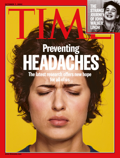 A picture of a woman suffering from a headache.