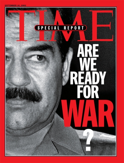 A black and white photo of Saddam Hussein
