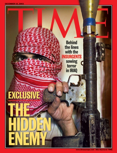 A photo of an Iraqi insurgent holding an RPG.