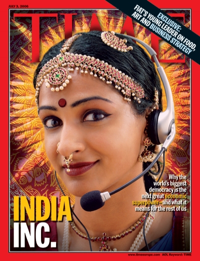 A photo of a traditionally dressed indian woman wearing a telephone headset
