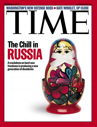 A photo of a matryoshka with duct tape over her mouth.