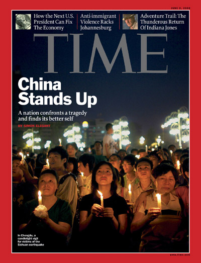 People in China attend a candlelight vigil.