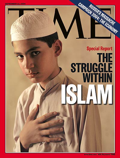 A photo of a young Muslim boy with his hand over his heart.