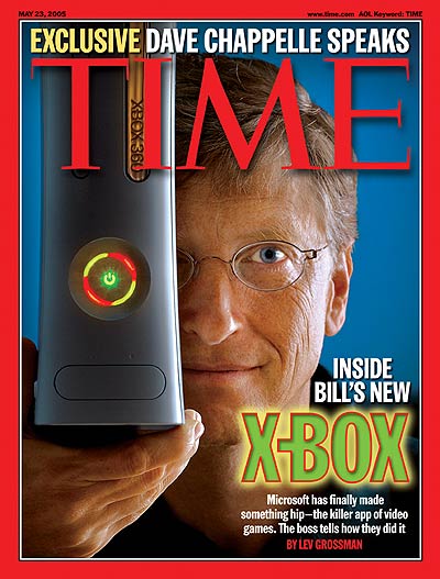 A photo of Bill Gates holding an X-Box.