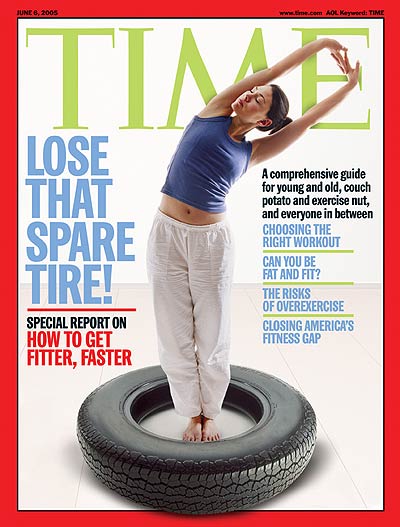 Photo of a woman exercising while standing in a tire.
